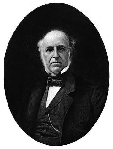 Retrato oval de Thomas Bulfinch con traje oscuro, chaleco y moño.