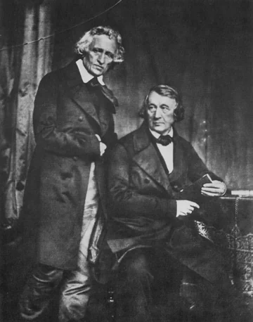 Jacob y Wilhelm Grimm juntos: uno de pie y el otro sentado, en un daguerrotipo de 1847.